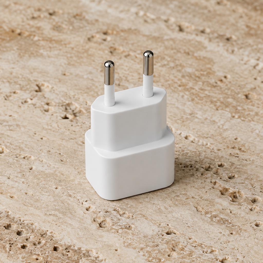A white European two-pin travel adapter